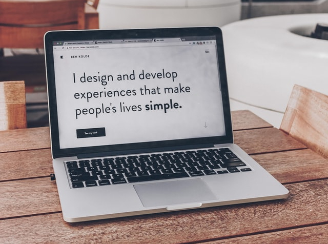 Picture of laptop that says "I design and develop experiences that make people's lives SIMPLE'